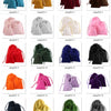 A collection of velvet drawstring jewelry gift bags in various colors including black, red, gold, pink, and green.