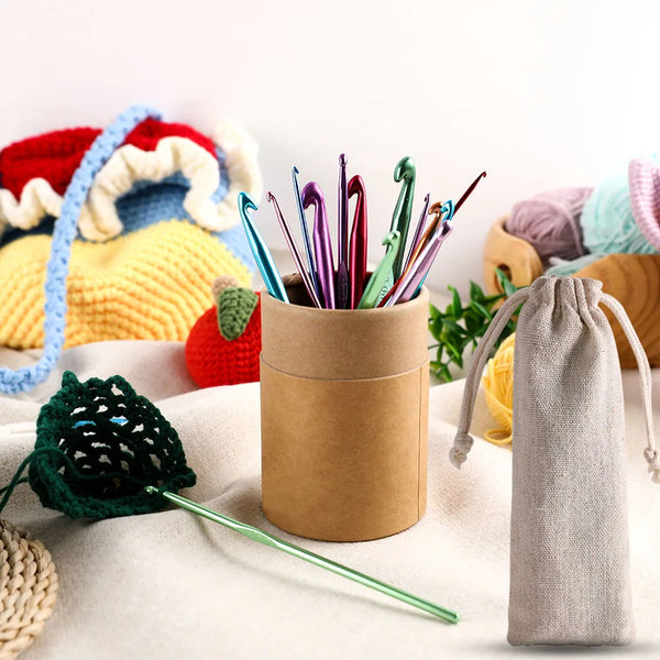 A collection of colorful mixed-size Tunisian crochet hooks stored in a brown cylindrical container.