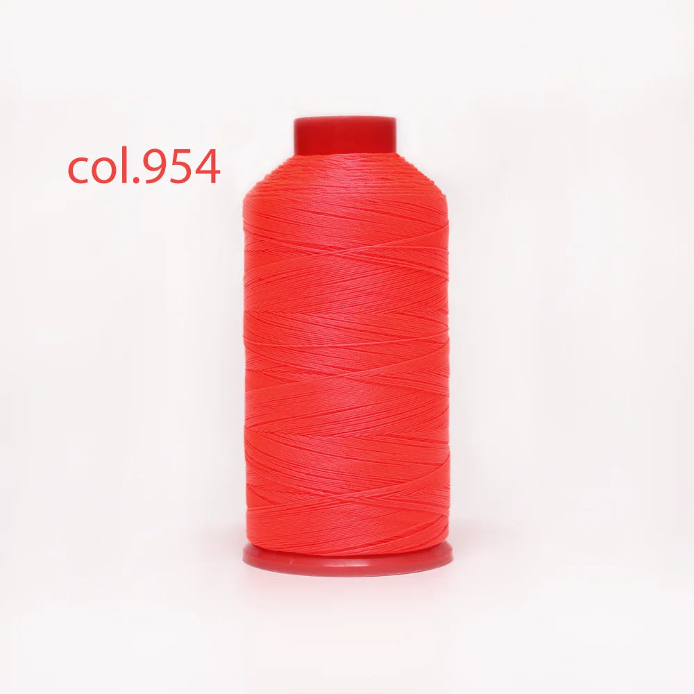 A spool of bright red heavy duty nylon sewing thread labeled col.954.