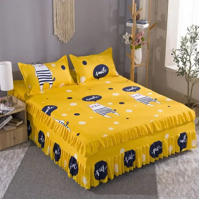 Yellow fitted bed sheets with white and blue polka dots and smiling face patterns