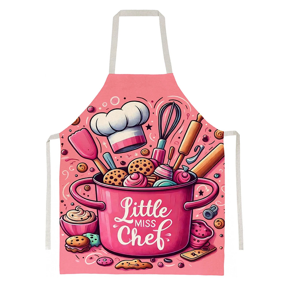 Pink kitchen apron featuring a baking design with various pink and yellow kitchen tools.
