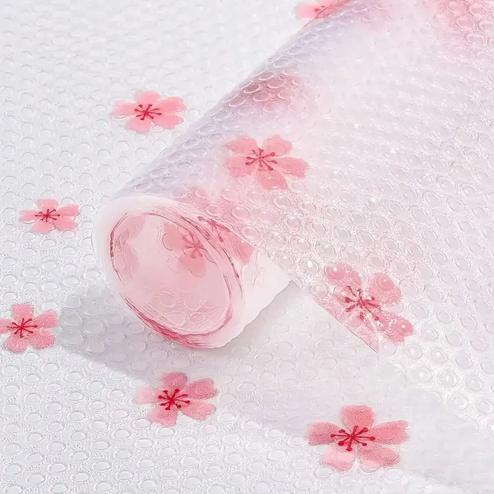 Pink reusable fridge and cabinet liner pads with floral patterns