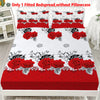 A red rose printed fitted bedspread without a pillowcase displayed on a white bed frame.