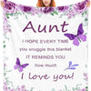 A purple floral blanket featuring a butterfly design and the text I hope every time you snuggle this blanket it reminds you h