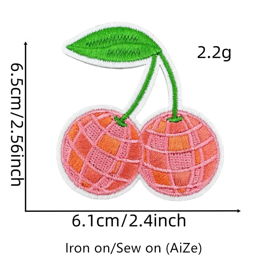 Two pink and orange embroidered fruit patches, measuring 6.5cm high and 6.1cm wide.