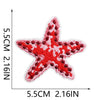 A red star shaped embroidered patch with white detailing on a white background.