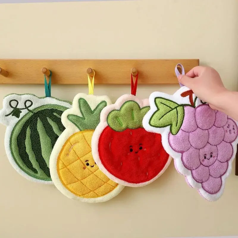 A collection of adorable floral fruit shaped coral fleece hanging hand towels on a wooden rack.