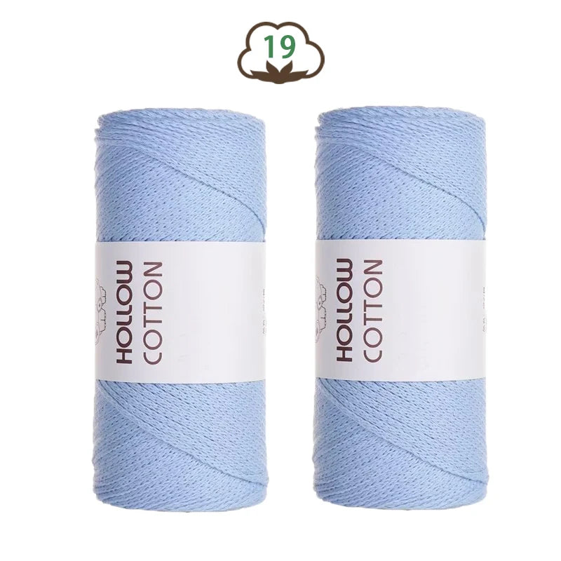 Two spools of light blue hollow cotton yarn for crafting