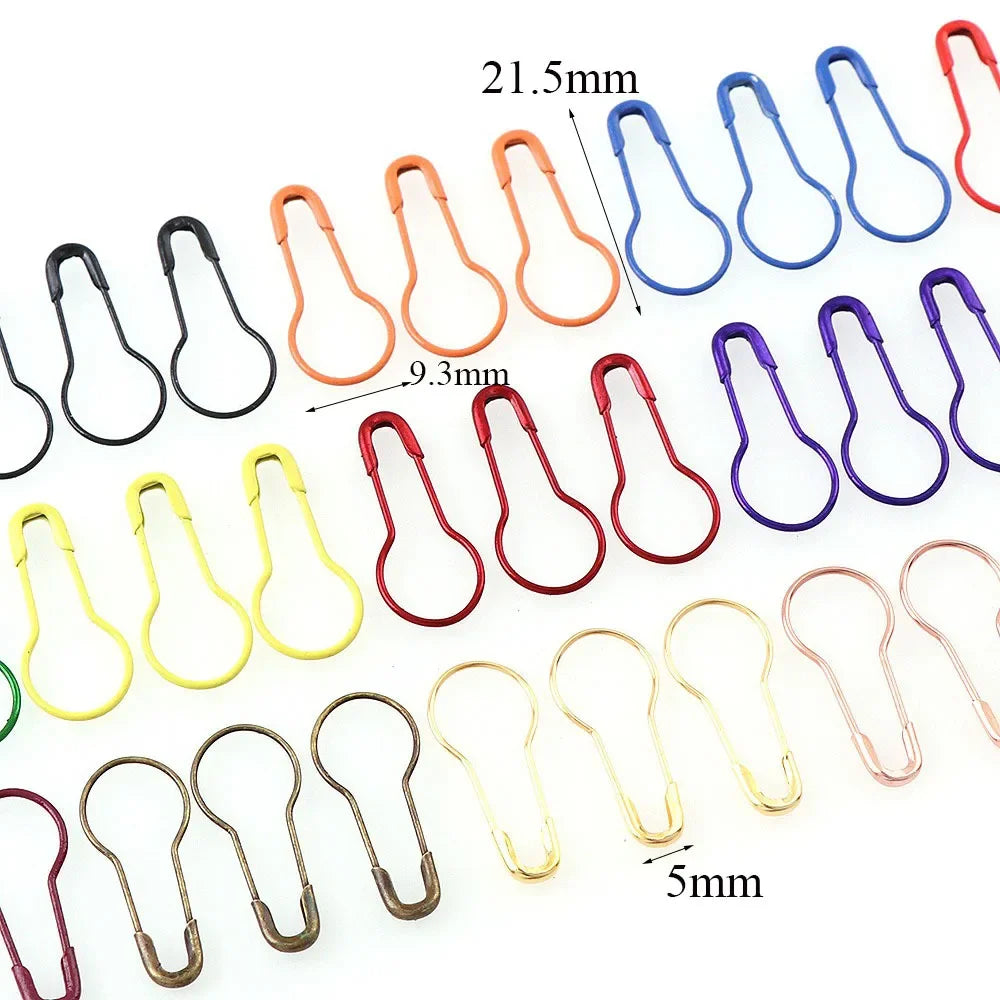 A collection of colorful safety bulb pins for knitting and sewing in various sizes and colors.