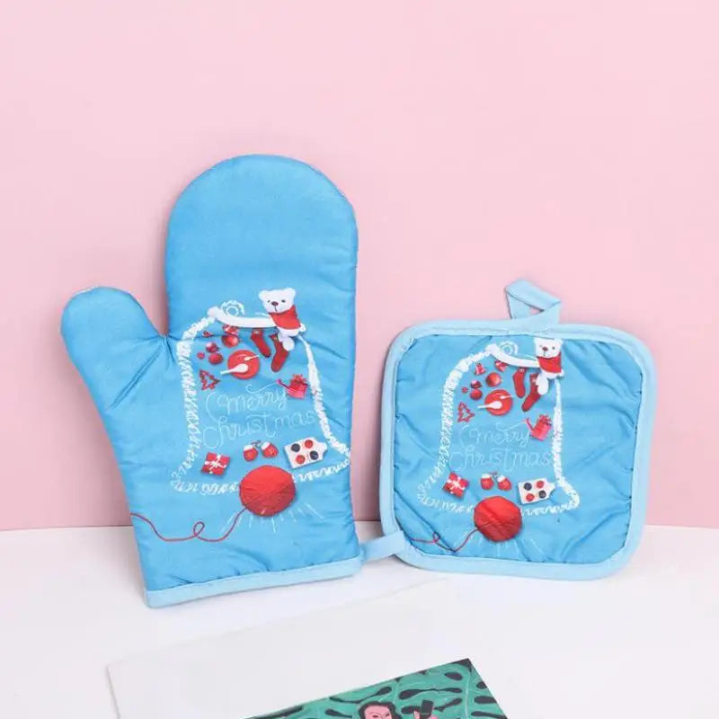 Blue insulated oven mitts featuring a festive Christmas design with Santa and a snowman.