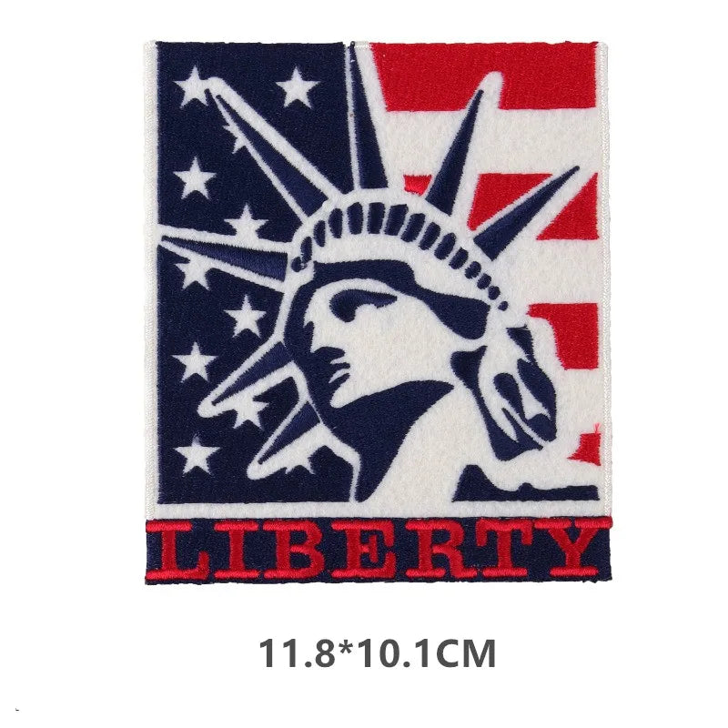 Embroidered patch featuring a silhouette of an eagle head on a blue field with white stars and red stripes, with the word LIB