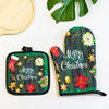 Green insulated oven mitts featuring a Merry Christmas design with holly, stars, and festive elements.