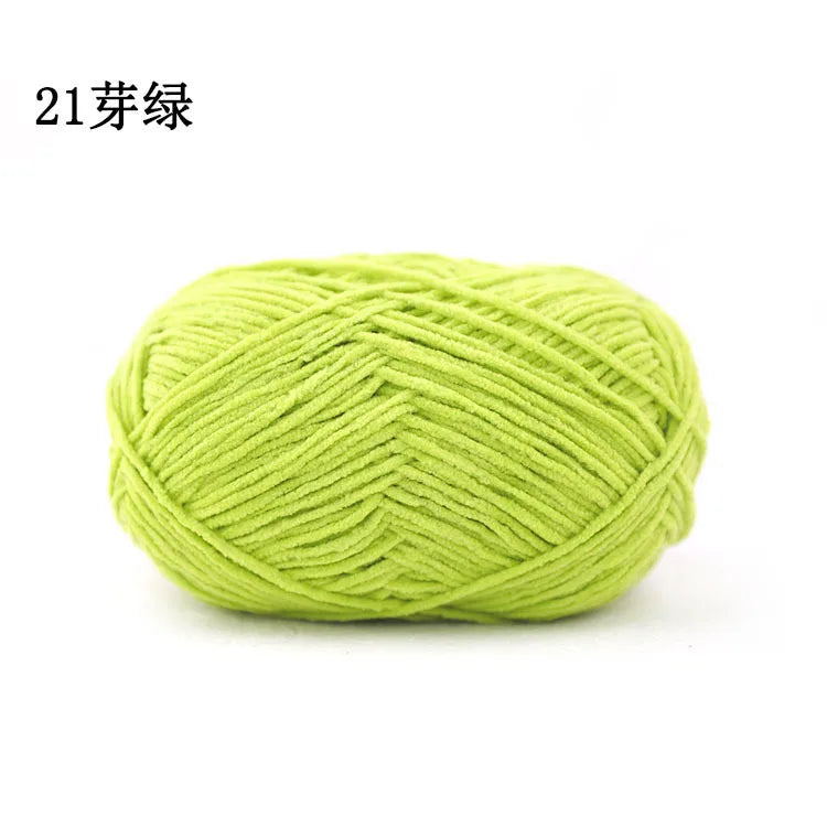 A ball of bright lime green 21-ply matte chenille yarn for knitting and crochet.