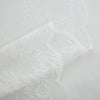 White knitted lace sheer curtain fabric showing a close-up texture and drape.