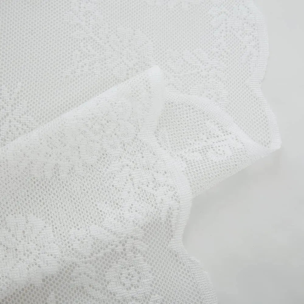 White knitted lace sheer curtain fabric showing a close-up texture and drape.