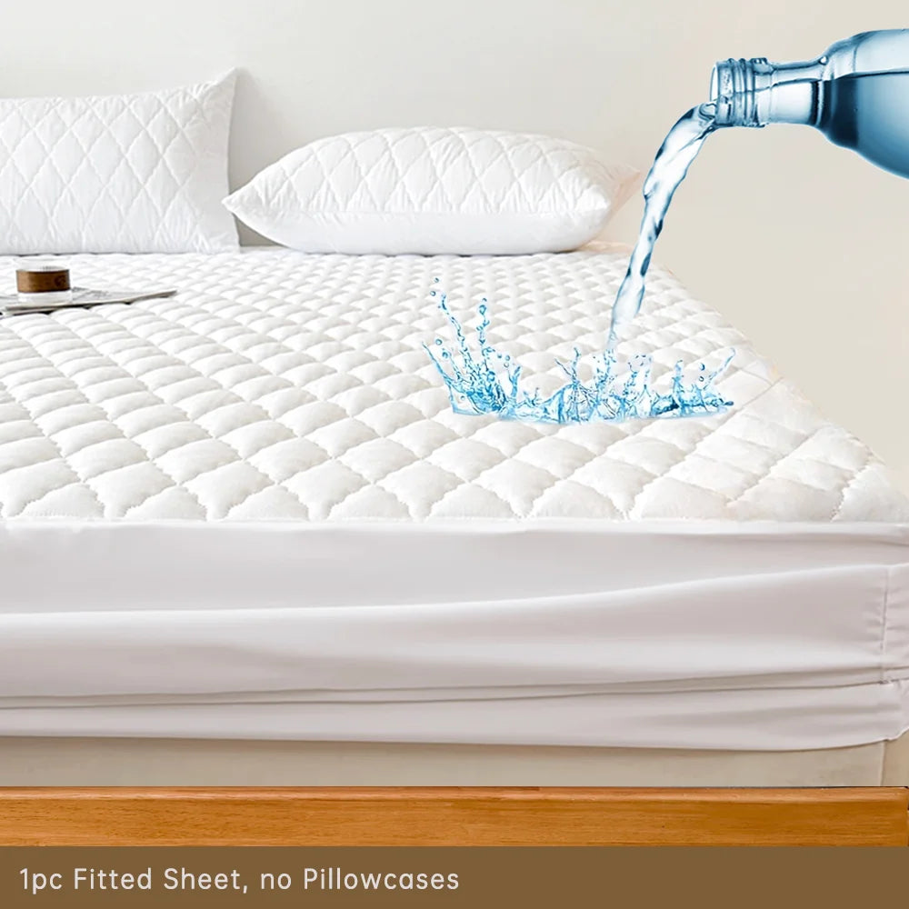 A close-up of a white fitted sheet mattress protector being filled with water on a bed.