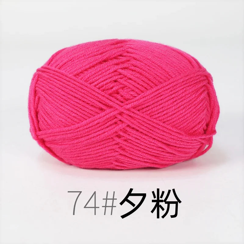 A ball of bright pink organic cotton 4ply knitting yarn for crafts.