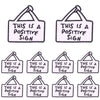 A set of ten embroidered letter Slogan applique patches for DIY clothing featuring the text This is a positive sign.