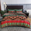 A richly patterned boho geometric duvet cover set featuring vibrant reds, greens, and browns on a bed.