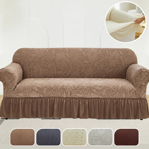 Brown jacquard stretch sofa cover with ruffle detail shown on a white background.