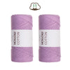 Two spools of lilac purple hand-knitted cotton yarn for crafting