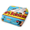 A colorful throw blanket featuring a cartoon style of a burger and text that reads 'Bob's Burgers'.
