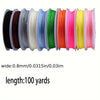 A collection of colorful nylon cords in various shades including black, brown, white, blue, green, orange, pink, and yellow.