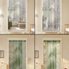 A set of translucent lace door curtains featuring sun and moon patterns in green and white tones.