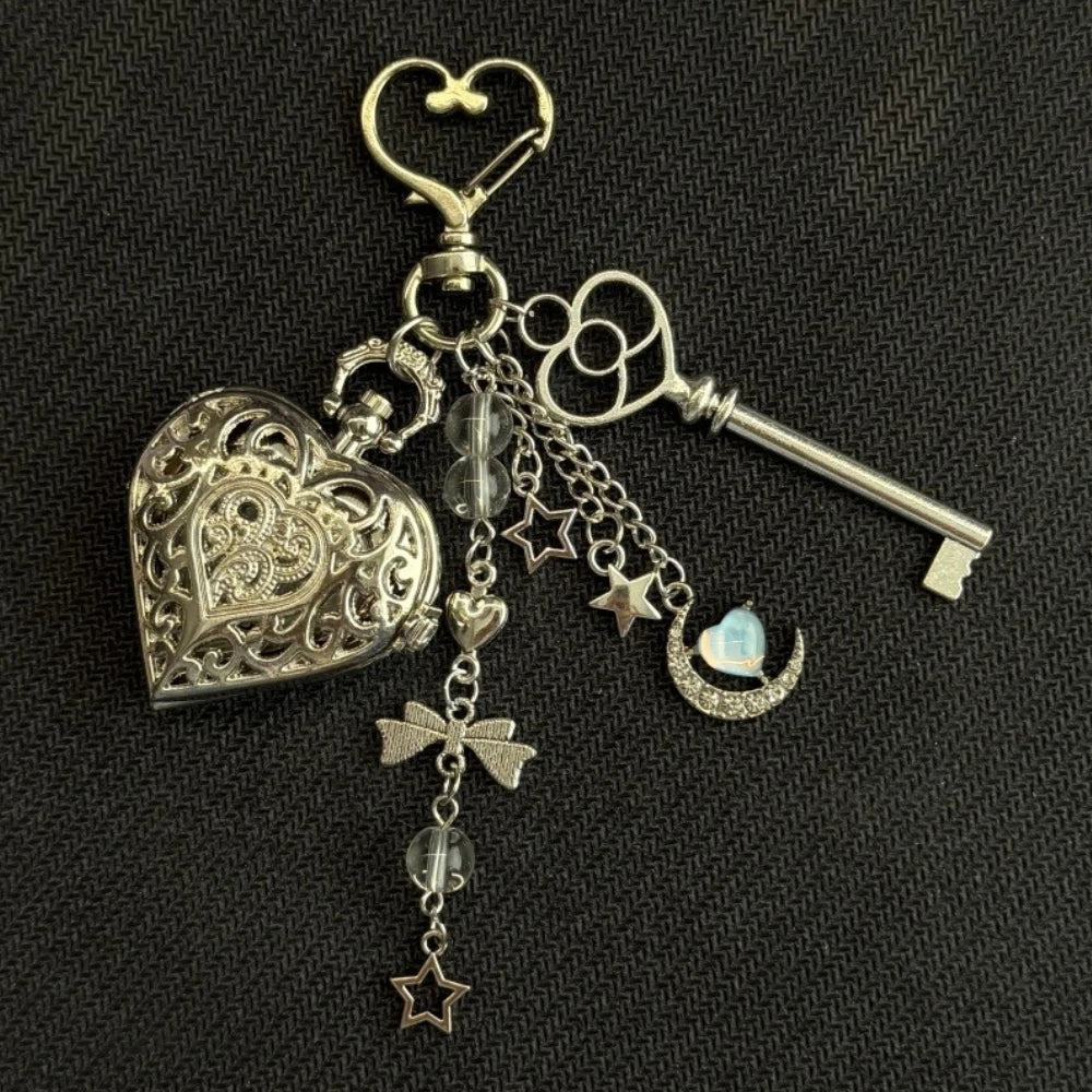 Silver star pocket watch keychain featuring an adjustable clock mechanism and decorative elements.