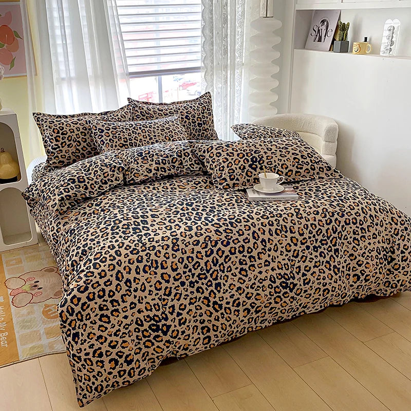 A leopard print duvet cover set with two pillowcases displayed on a bed in a bright room.
