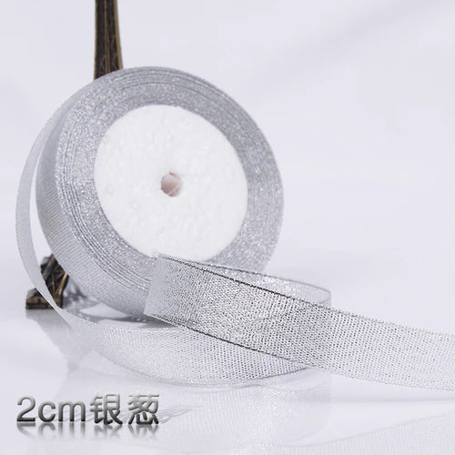 Roll of silver glitter organza ribbon for gift wrapping and DIY crafts