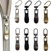 A collection of replacement metal zipper pulls in various finishes and styles for bags and luggage.