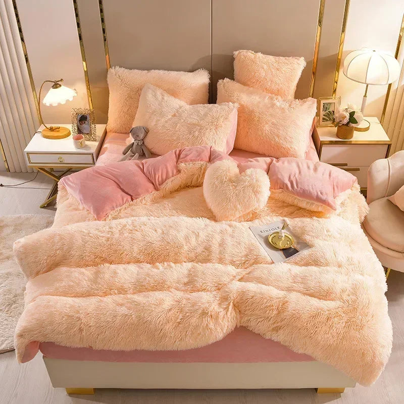 A fluffy pink and cream plush mink velvet duvet set displayed on a bed with gold accents.