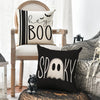 A set of four Halloween cushion covers featuring ghost, pumpkin, and skull designs on black and white fabric.