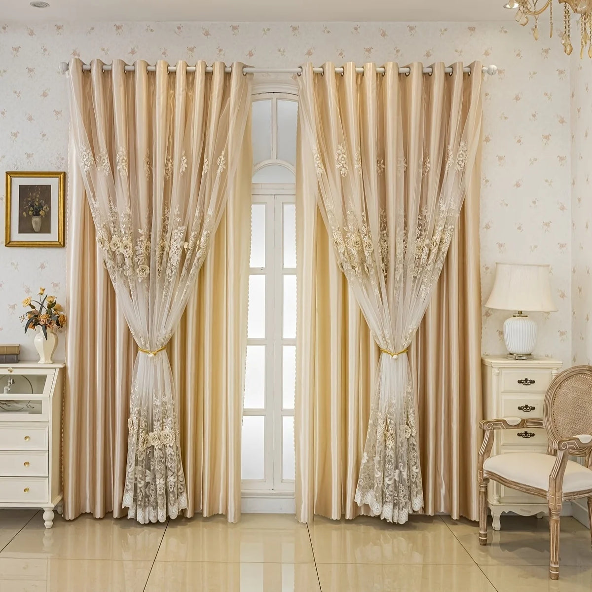 Cream-colored double layer blackout curtains with floral embroidery hanging in a bright room.