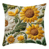 A decorative cushion pillow cover featuring embroidered sunflowers in yellow and white on a natural fabric background.