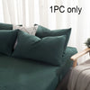 A set of dark teal and beige pillows on a bed with sheer curtains, labeled 1PC only.