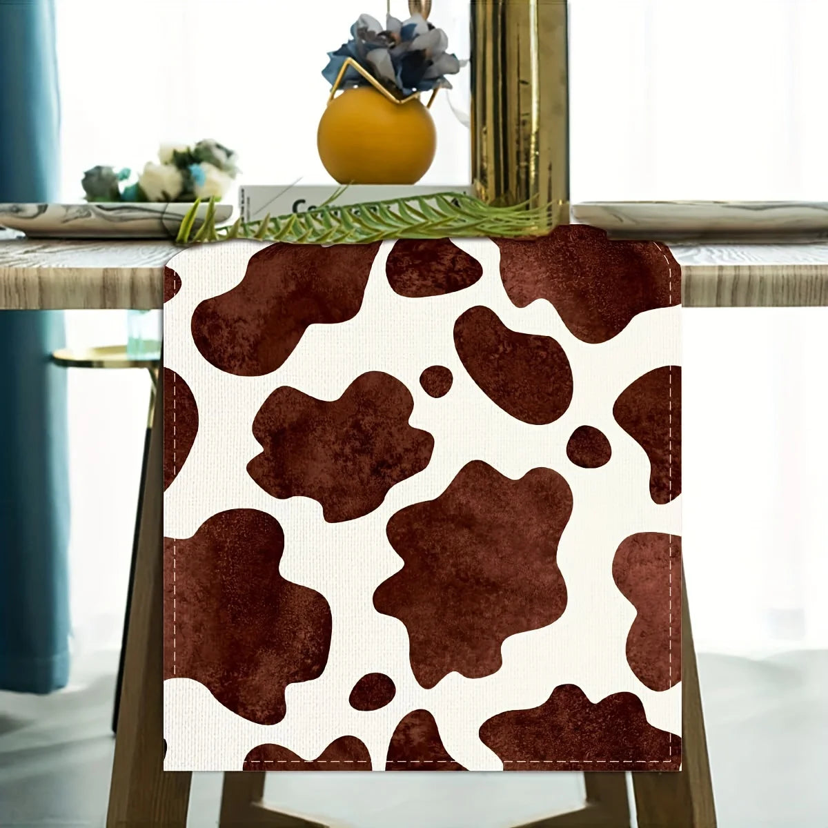 A brown and white abstract pattern linen table runner for rustic kitchen decor