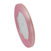 Pink satin ribbon with gold edges rolled into a cylinder for gift wrapping and crafts