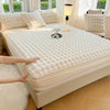 A white luxury faux rabbit fur fitted sheet set is displayed on a bed, with hands touching the fabric.