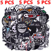 A collection of assorted black and white embroidered punk patches for DIY clothing.