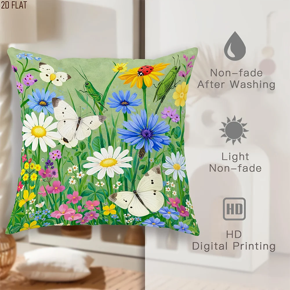A green throw pillow cover featuring a vibrant floral pattern of white, yellow, purple, and blue wildflowers.