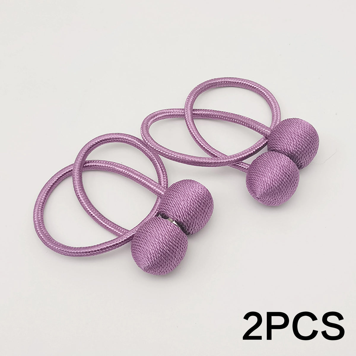 Two lavender magnetic ball curtain tiebacks with thin elastic loops