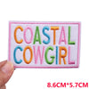 Pink embroidered patch with the text COASTAL COWGIRL in colorful thread.