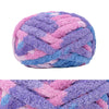 A ball of hand-knitted wool finger line scarf in purple and pink colors.