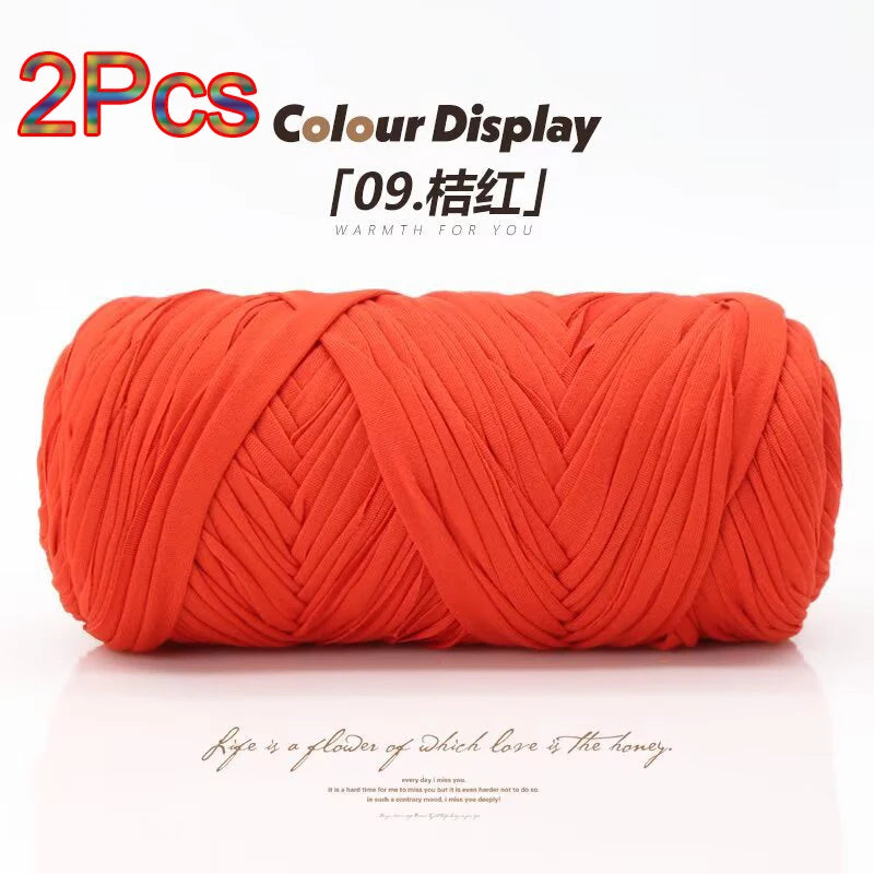Two skeins of bright orange elastic yarn displayed for crafting