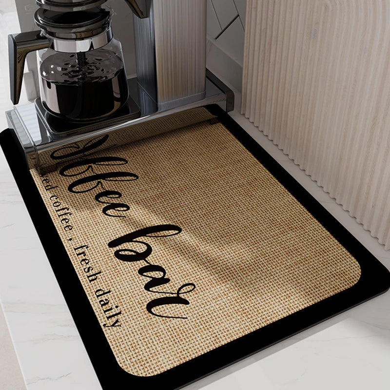 A black drainer mat with the text 'Coffee Bar fresh daily' is placed under an insulated coffee cup.