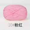 A ball of pink organic cotton 4ply knitting yarn for crafts.