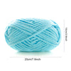 A ball of light blue thick velvet yarn used for knitting and crochet projects.