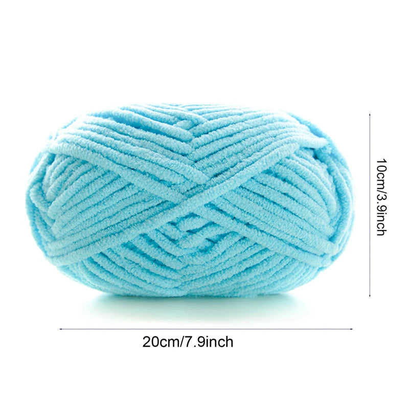 A ball of light blue thick velvet yarn used for knitting and crochet projects.